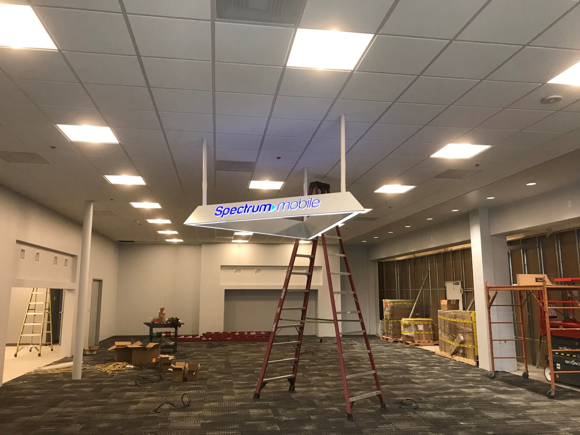 Spectrum hanging sign and lights install