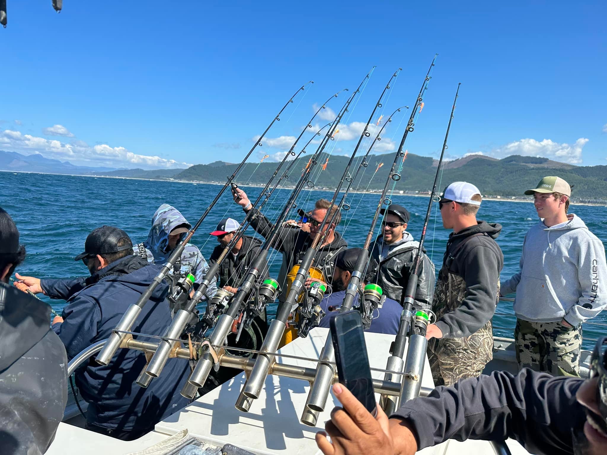 Group deep sea fishing on a boat.