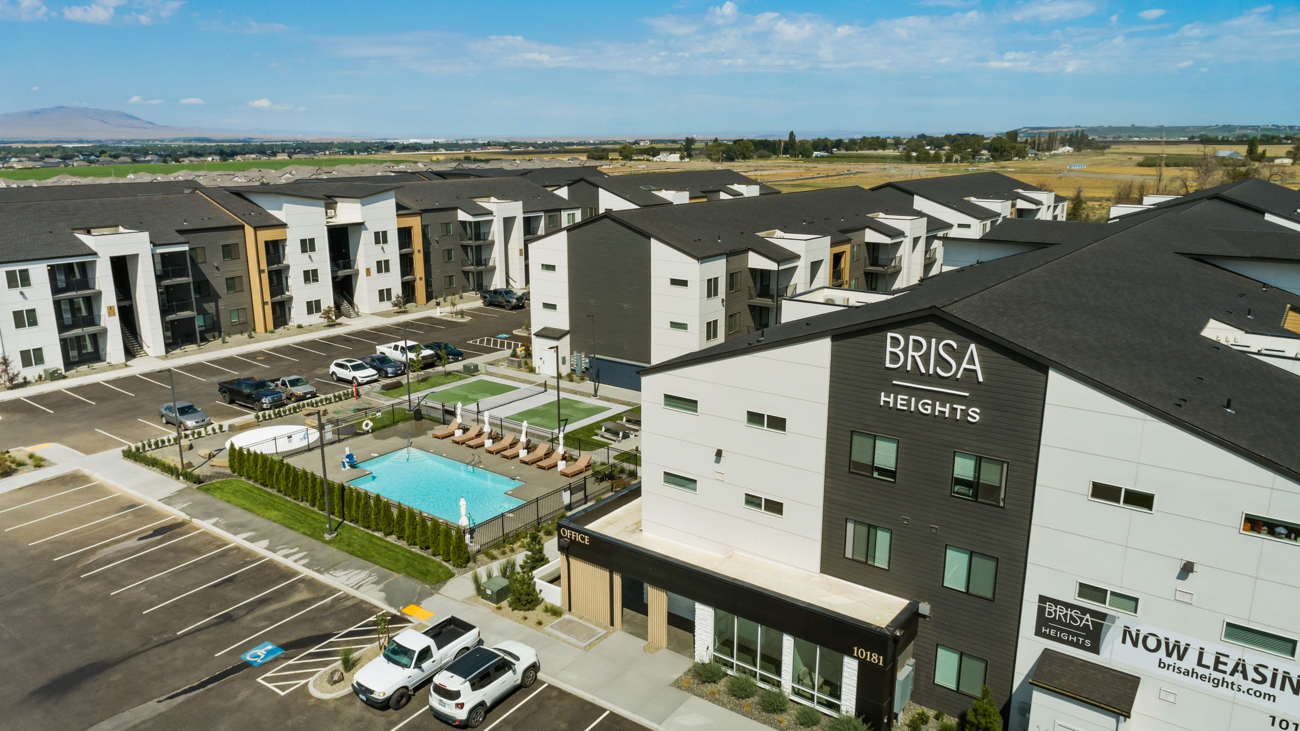 Brisa Heights apartments with pool and parking area.