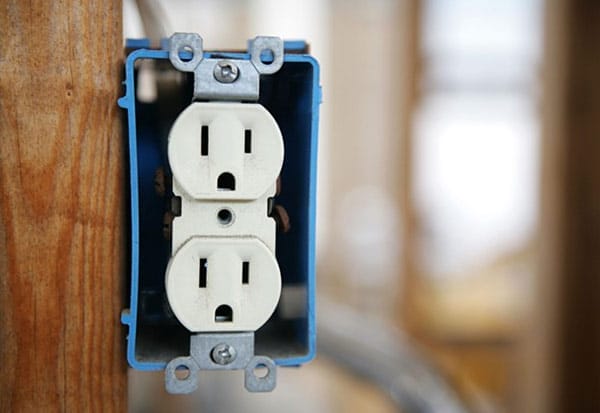 Uncovered electrical outlet installed in a wall box