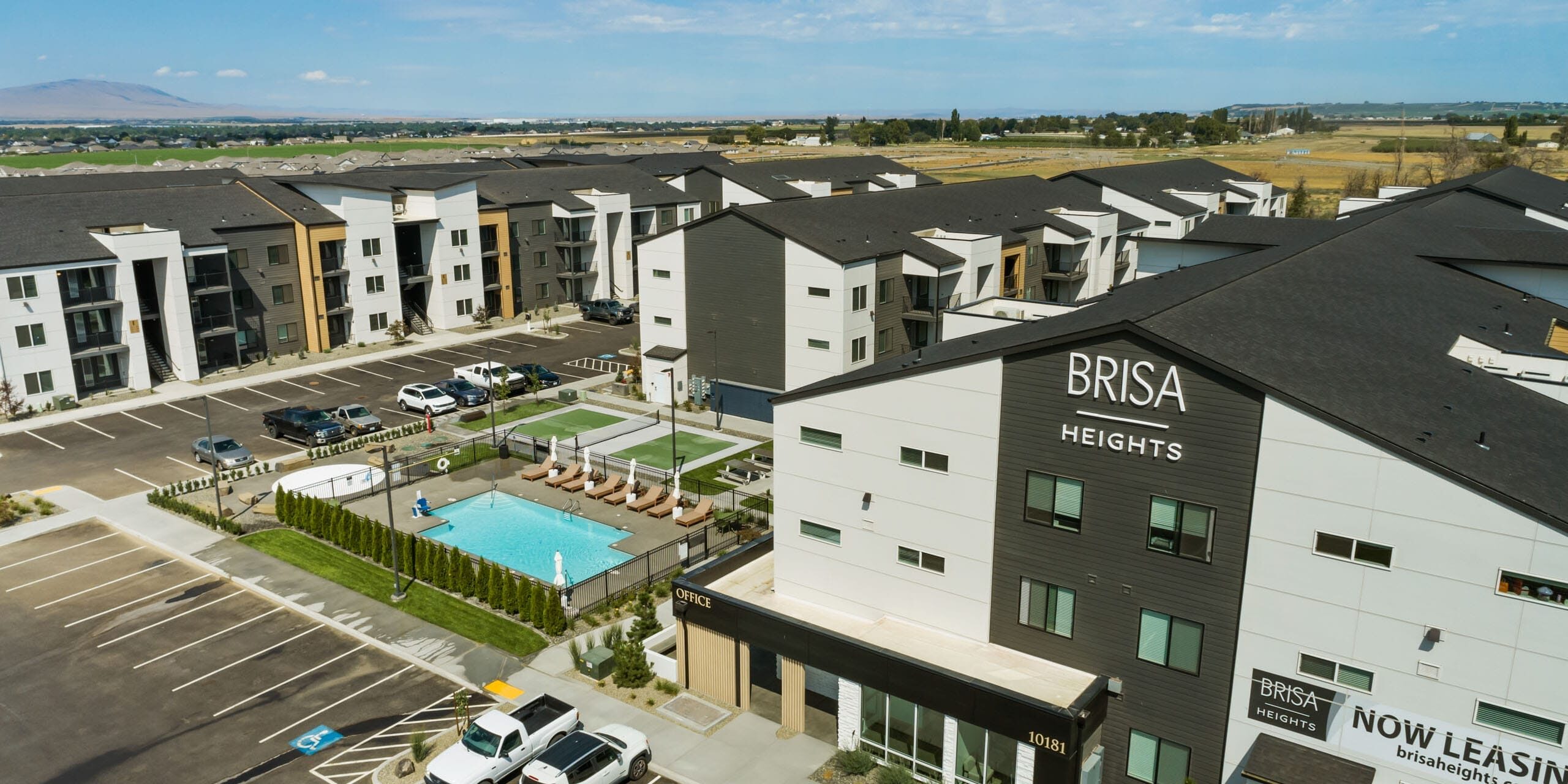 Brisa Heights apartments with pool and parking area.