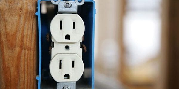 Uncovered electrical outlet installed in a wall box